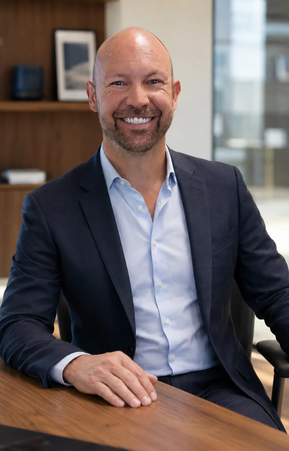 AI portrait of Shawn Way seated at a desk in a navy blazer