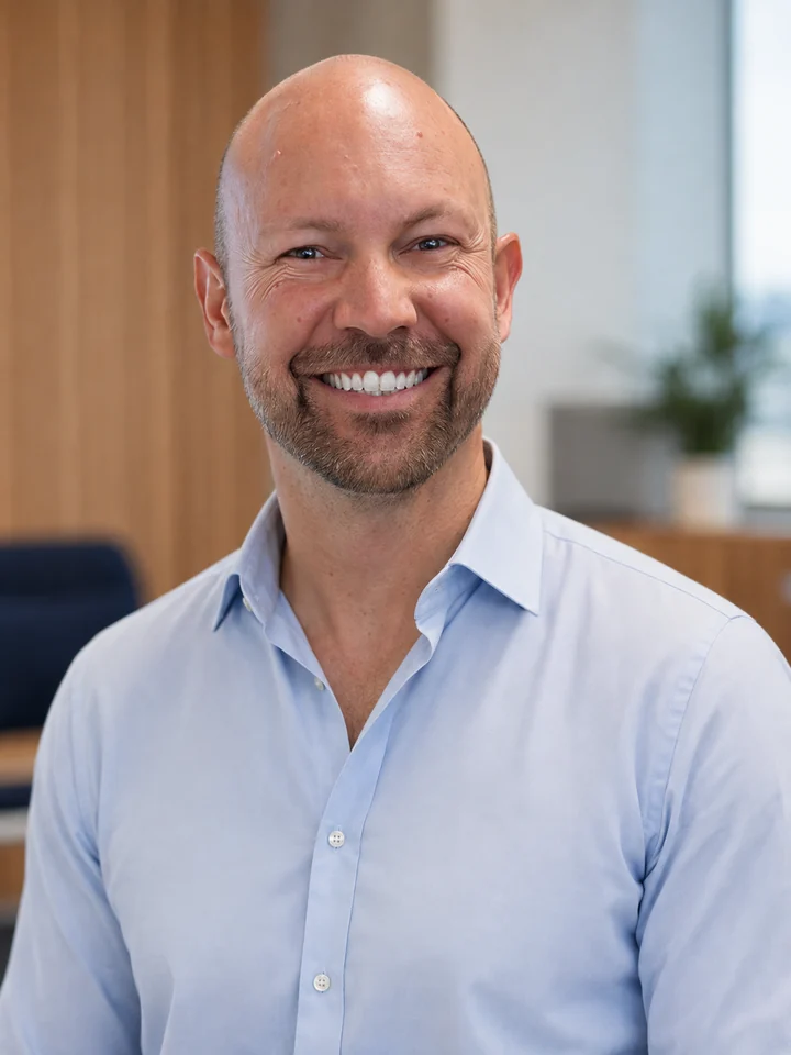 AI portrait of Shawn Way smiling in a light-blue shirt